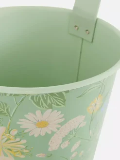 Wisząca metalowa doniczka ze wzorem w kwiaty