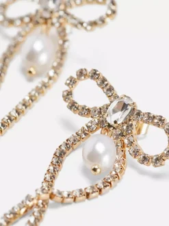 Wiszące kolczyki w kształcie kokardki z diamencikami