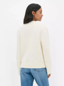 Zapinany na guziki sweter rozpinany z dekoltem w serek